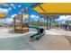 Community splash pad with slides and water features at 7793 Clove Hitch Way, Orlando, FL 32832