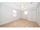 Bright, airy bedroom with new floors, two windows, and a built-in closet perfect for storage at 790 Park Ln, Kissimmee, FL 34741