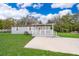 Charming single-story home with a covered front porch and well-maintained lawn at 790 Park Ln, Kissimmee, FL 34741