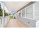 Inviting front porch featuring a covered area, white railings, and a welcoming entrance to the home at 790 Park Ln, Kissimmee, FL 34741