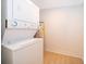 A laundry room featuring a stacked washer and dryer unit at 790 Park Ln, Kissimmee, FL 34741