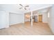 Bright living room with white walls, wood-look floors, and an open kitchen area at 790 Park Ln, Kissimmee, FL 34741