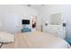 Bright, airy bedroom featuring hardwood floors, ample closet space, and a serene atmosphere at 8204 Fan Palm Way, Kissimmee, FL 34747