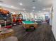 A game room offering arcade games, a pool table, and a ping pong table at 8204 Fan Palm Way, Kissimmee, FL 34747