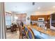 Bright kitchen boasts granite counters, bar seating and a cozy breakfast nook with lots of natural light at 8204 Fan Palm Way, Kissimmee, FL 34747
