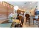 Open kitchen and breakfast nook with wood cabinets, granite countertops, and lots of natural light at 8204 Fan Palm Way, Kissimmee, FL 34747