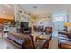 Spacious living room featuring comfortable seating, a dining area, and an open concept layout at 8204 Fan Palm Way, Kissimmee, FL 34747