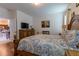 Spacious primary bedroom with wood floors, natural light, and a warm, inviting ambiance at 8204 Fan Palm Way, Kissimmee, FL 34747