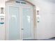 View of the Movie Theater entrance with sconces and signage for the theater inside at 8204 Fan Palm Way, Kissimmee, FL 34747