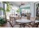 Enjoy the shade on the patio with brick floors, multiple tables, and views of the pool and outdoor bar at 8204 Fan Palm Way, Kissimmee, FL 34747