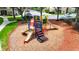 Colorful playground aerial featuring multiple slides, stairs, and play areas on a wood chip base at 8204 Fan Palm Way, Kissimmee, FL 34747