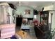 Overstuffed bedroom with light green walls and closet in disarray at 731 Trenton Rd, Lakeland, FL 33815