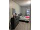 Modest bedroom featuring modern decor and neutral tones at 10538 Clarcona Ocoee Rd, Apopka, FL 32703