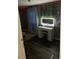 Bedroom features vanity table, hardwood floors, and natural light at 10538 Clarcona Ocoee Rd, Apopka, FL 32703