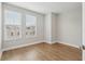 Bright bedroom with wood-style floors and two sunny windows at 117 E Concord St # 8, Orlando, FL 32801