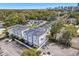 Aerial view of a three-story townhouse featuring a gray facade, black roof, and in close proximity to the city at 117 E Concord St # 8, Orlando, FL 32801