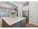Open concept kitchen with island, stainless steel appliances, and access to the living area at 117 E Concord St # 8, Orlando, FL 32801