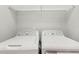 Neat laundry room with a wire shelf above the side-by-side washer and dryer at 117 E Concord St # 8, Orlando, FL 32801