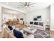 Bright living room featuring an open layout, hardwood flooring, and modern ceiling fan at 117 E Concord St # 8, Orlando, FL 32801