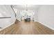Open-concept living space with stairs, hardwood floors, and a modern kitchen island at 117 E Concord St # 8, Orlando, FL 32801