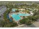 Aerial view of community pools, recreation areas, landscaping, and parking at 13041 Gabor Ave, Orlando, FL 32827