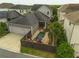 Aerial view of backyard pool with palm trees and a two-car garage at 13041 Gabor Ave, Orlando, FL 32827