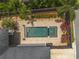 Aerial view of a private backyard pool with a spa and brick patio at 13041 Gabor Ave, Orlando, FL 32827