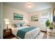 Beautifully decorated bedroom with hardwood floors, an area rug, and neutral-toned decor at 13041 Gabor Ave, Orlando, FL 32827