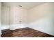 Unfurnished bedroom with wood floors, white trim, white walls, and double-door closet at 13041 Gabor Ave, Orlando, FL 32827