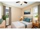 Stylishly decorated bedroom with hardwood floors, area rug, and neutral-toned decor at 13041 Gabor Ave, Orlando, FL 32827