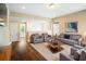 Bonus room with hardwood floors, TV, and views of the neighborhood at 13041 Gabor Ave, Orlando, FL 32827