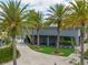 Attractive building exterior features tropical plants and palms at 13041 Gabor Ave, Orlando, FL 32827