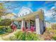 Charming two-story home with a welcoming front porch and colorful landscaping at 13041 Gabor Ave, Orlando, FL 32827