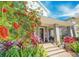Charming two-story home with gray siding, stone accents, and lush landscaping at 13041 Gabor Ave, Orlando, FL 32827