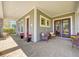 Charming front porch with comfortable seating, ideal for enjoying the outdoors at 13041 Gabor Ave, Orlando, FL 32827