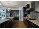 Gourmet kitchen featuring stainless steel appliances and stylish cabinetry at 13041 Gabor Ave, Orlando, FL 32827