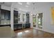 Kitchen area with wine fridge and custom cabinets at 13041 Gabor Ave, Orlando, FL 32827