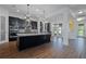 Spacious kitchen with dark cabinets, large island, and stainless appliances at 13041 Gabor Ave, Orlando, FL 32827