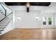Spacious living room with hardwood floors and staircase at 13041 Gabor Ave, Orlando, FL 32827