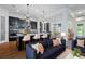 Open-concept kitchen and living room features hardwood floors, dark island, and modern furnishings at 13041 Gabor Ave, Orlando, FL 32827