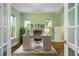 Bright home office with natural light, modern desk, and a neutral color scheme at 13041 Gabor Ave, Orlando, FL 32827