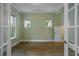 Well-lit office space with wood floors and French door entry at 13041 Gabor Ave, Orlando, FL 32827