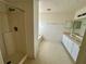 Bathroom with tub and dual sink vanity in an unfinished home ready for renovation at 1322 Aguacate Ct, Orlando, FL 32837