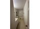 Narrow bathroom features a shower-tub combo and single vanity at 1322 Aguacate Ct, Orlando, FL 32837
