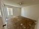 Empty bedroom with window and carpet removed, ready for renovations at 1322 Aguacate Ct, Orlando, FL 32837