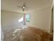 Empty bedroom with window and ceiling fan ready for renovations at 1322 Aguacate Ct, Orlando, FL 32837