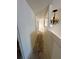 Upstairs hallway with chandelier lighting featuring a view of rooms and awaiting flooring updates at 1322 Aguacate Ct, Orlando, FL 32837
