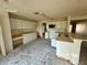 Spacious kitchen ready for customization, featuring ample cabinet space and a breakfast bar at 1322 Aguacate Ct, Orlando, FL 32837