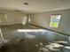 Bright living room with large windows and neutral walls, ready for personal touches at 1322 Aguacate Ct, Orlando, FL 32837