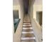 Interior staircase of an unfinished home with off-white walls at 1322 Aguacate Ct, Orlando, FL 32837